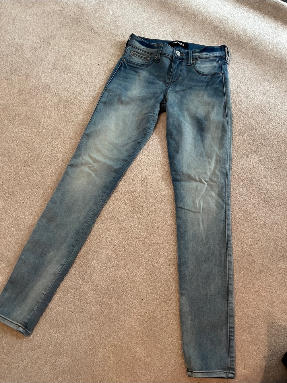 Express Skinny Jeans in Distressed Light Blue Wash